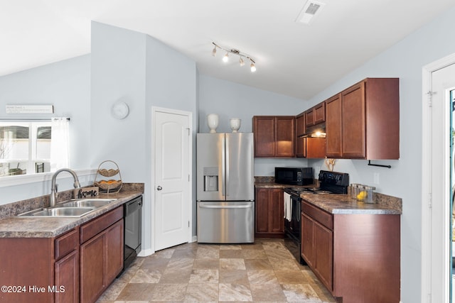 kitchen featuring black appliances, a sink, under cabinet range hood, dark countertops, and lofted ceiling