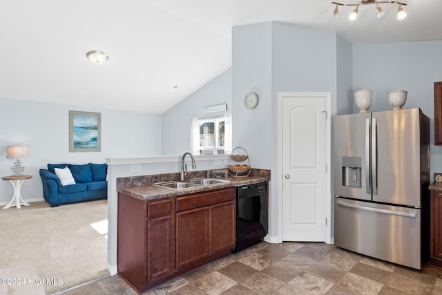 kitchen featuring a sink, black dishwasher, dark countertops, open floor plan, and stainless steel fridge