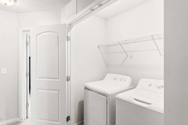 laundry room with washer and dryer, laundry area, and visible vents