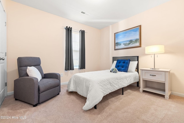 carpeted bedroom with baseboards and visible vents