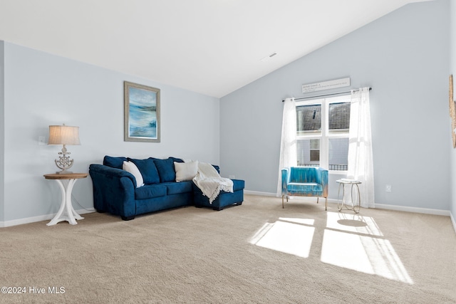 living area with vaulted ceiling, baseboards, and carpet floors