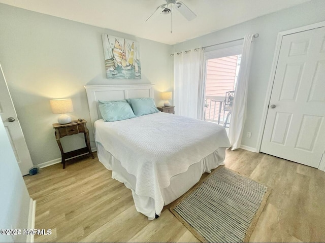 bedroom with light hardwood / wood-style flooring and ceiling fan