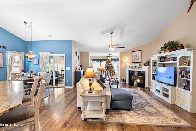 living room with hardwood / wood-style flooring and ceiling fan