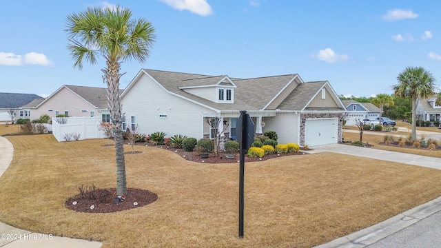 view of front facade featuring a garage and a front lawn