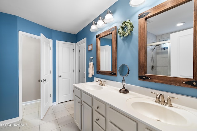 bathroom with tile patterned floors, a shower with door, and vanity