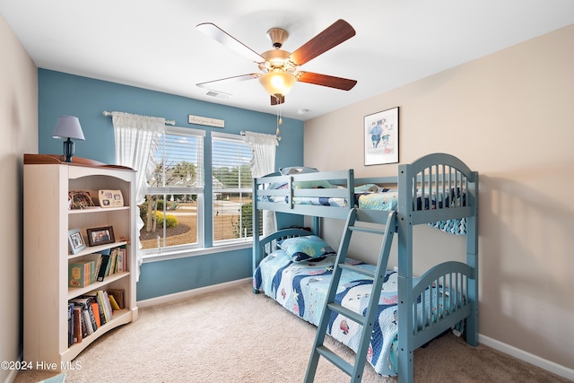 carpeted bedroom featuring ceiling fan