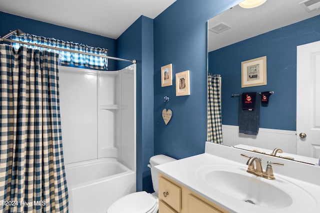 full bathroom featuring vanity, shower / tub combo, and toilet