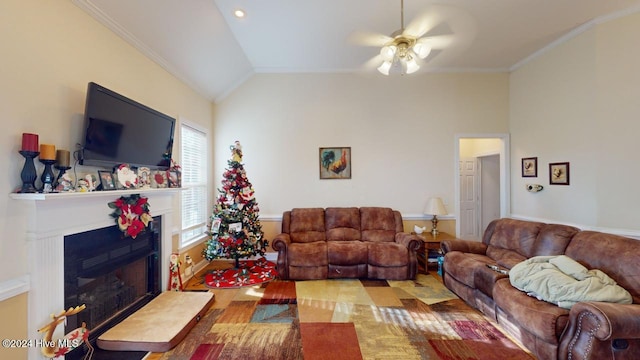 living room featuring ceiling fan, vaulted ceiling, and ornamental molding