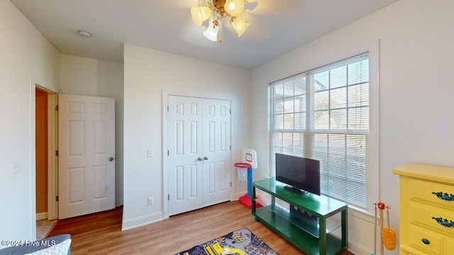 recreation room featuring hardwood / wood-style flooring and ceiling fan