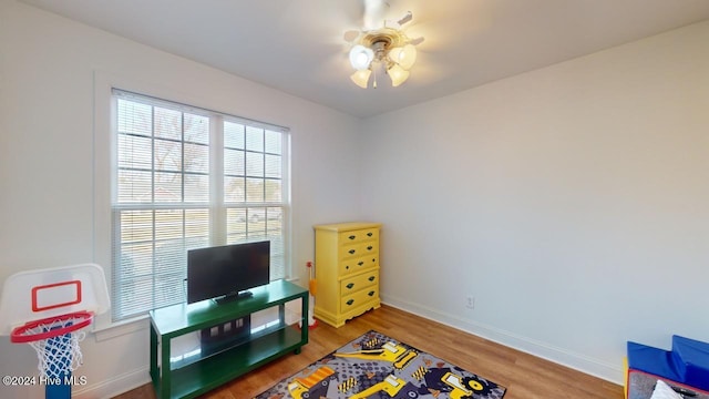 interior space with ceiling fan and hardwood / wood-style floors