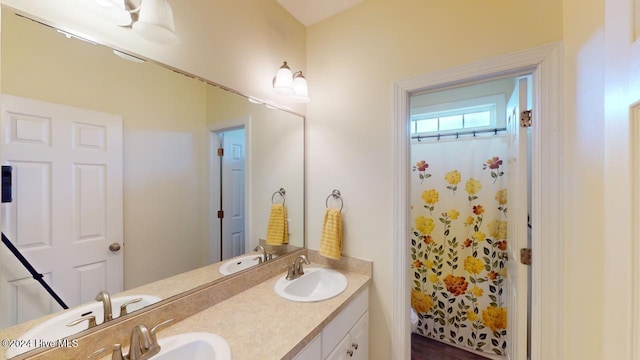 bathroom with walk in shower, vanity, and toilet