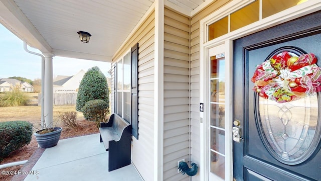 property entrance featuring a porch