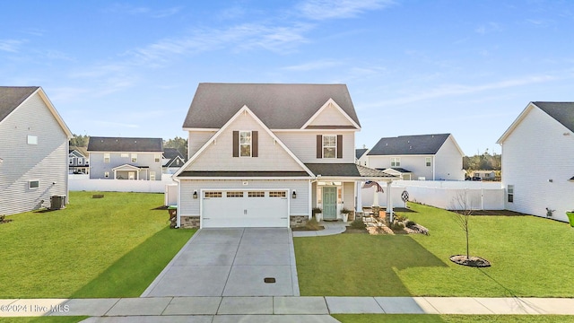 view of front of home featuring cooling unit, a garage, and a front yard