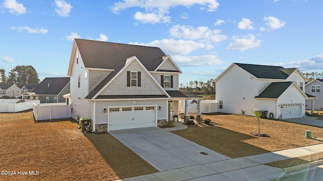 view of front property with a garage and a front lawn