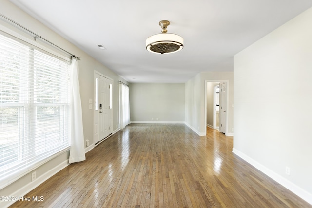 unfurnished room featuring hardwood / wood-style floors