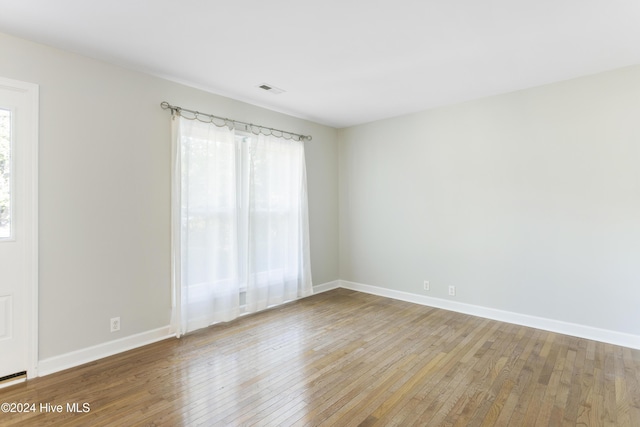 empty room with wood-type flooring