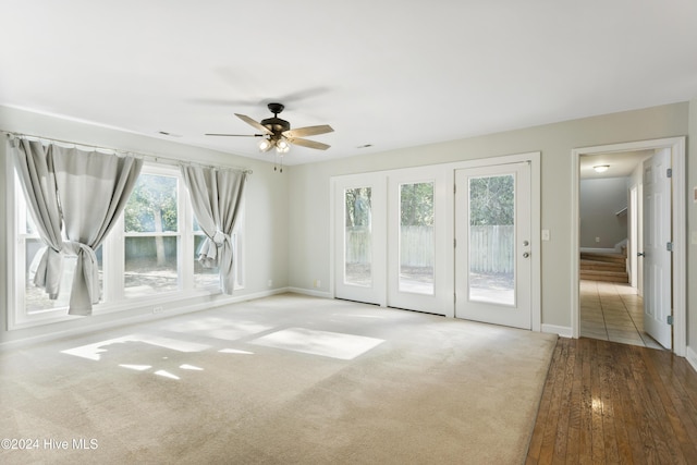 spare room featuring light hardwood / wood-style floors and ceiling fan