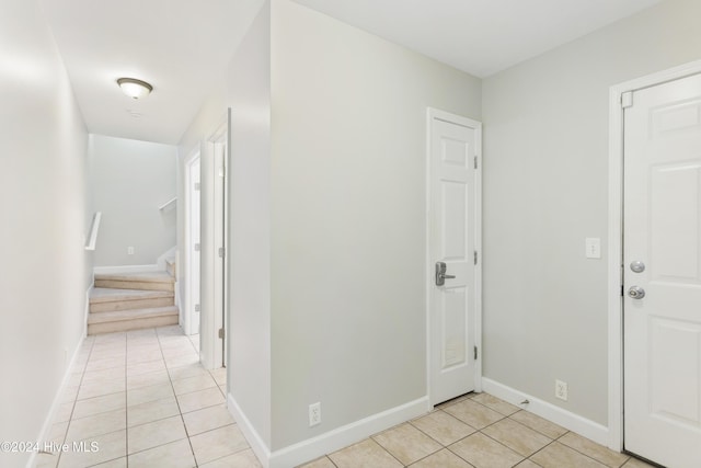 hall with light tile patterned flooring