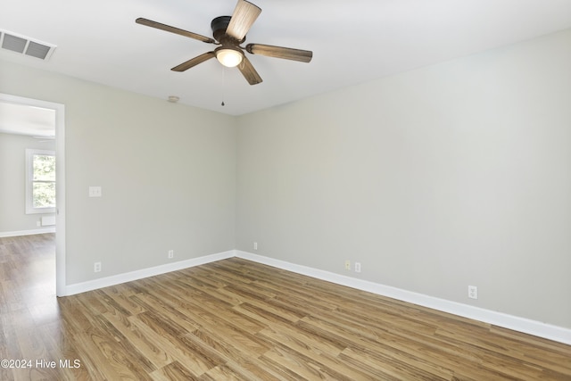 spare room featuring ceiling fan and light hardwood / wood-style flooring