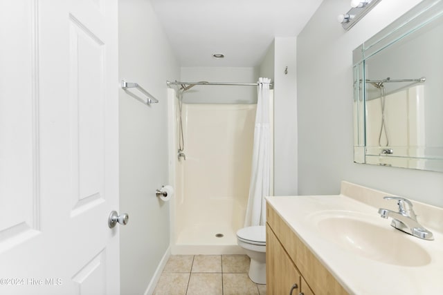 bathroom featuring tile patterned floors, a shower with curtain, vanity, and toilet