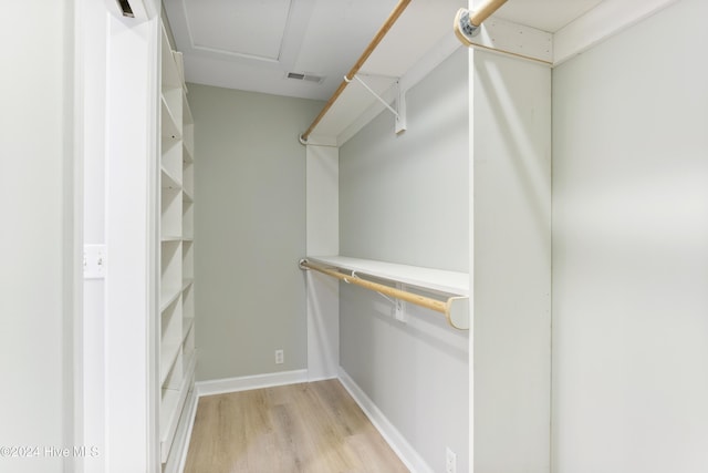 spacious closet featuring light wood-type flooring