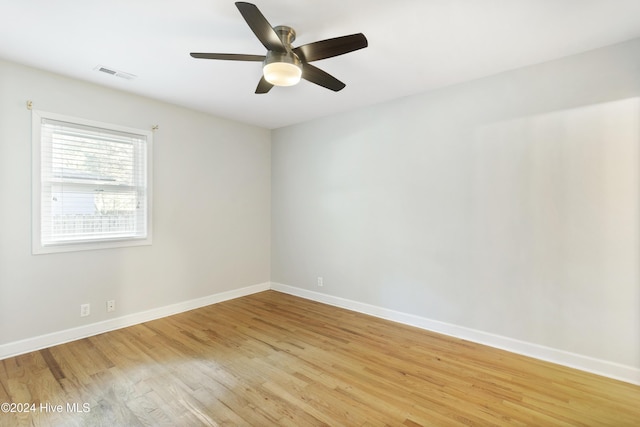 empty room with light hardwood / wood-style floors and ceiling fan