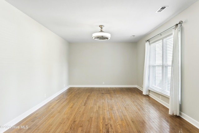 spare room with light hardwood / wood-style floors