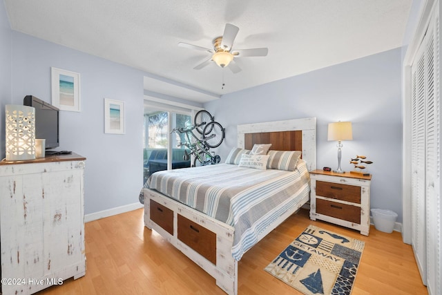 bedroom with ceiling fan and light hardwood / wood-style flooring