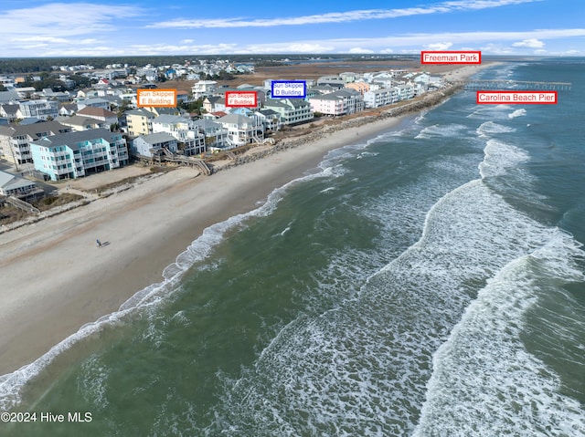 bird's eye view featuring a view of the beach and a water view