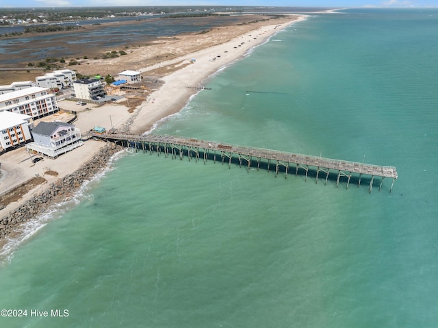 birds eye view of property with a water view and a view of the beach