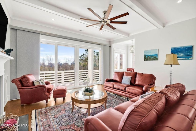 living room with beamed ceiling, ceiling fan, and wood-type flooring