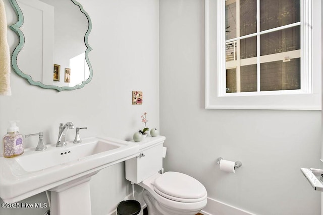 bathroom featuring sink and toilet