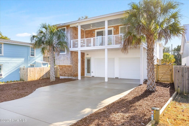 view of front of home featuring a garage and a balcony