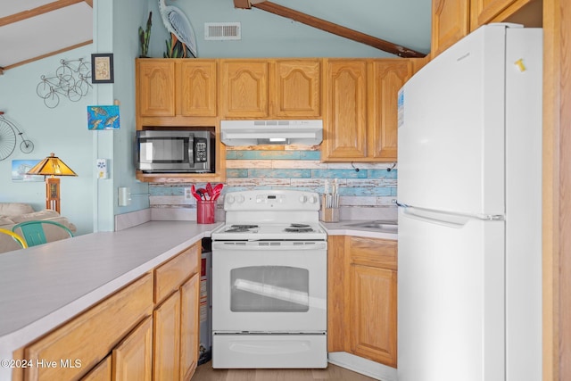 kitchen featuring white appliances and backsplash