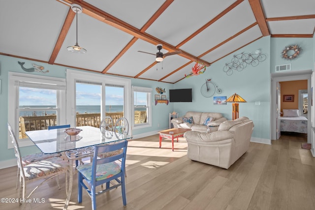 living room featuring a wealth of natural light, ceiling fan, and light wood-type flooring