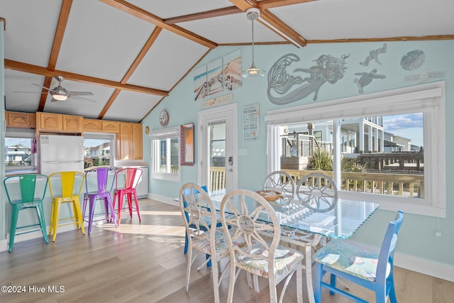 dining room featuring light hardwood / wood-style flooring, ceiling fan, and lofted ceiling