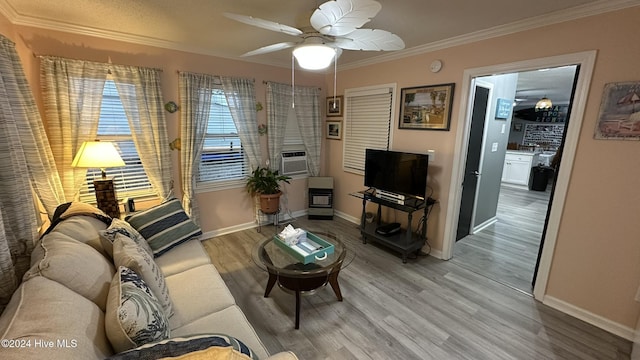 living room featuring ceiling fan, hardwood / wood-style floors, cooling unit, and crown molding