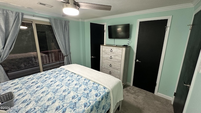 bedroom with ceiling fan, carpet, a textured ceiling, and ornamental molding