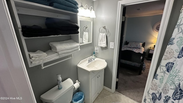 bathroom featuring vanity and toilet