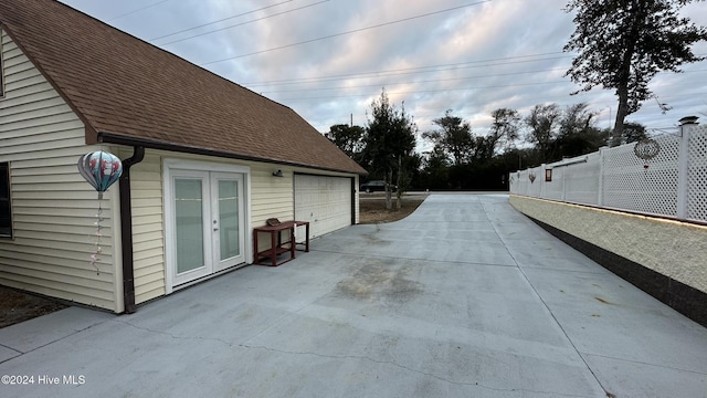 exterior space featuring french doors and a garage