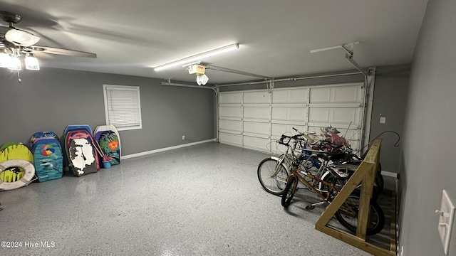 garage featuring a garage door opener and ceiling fan