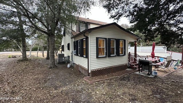 view of home's exterior featuring cooling unit