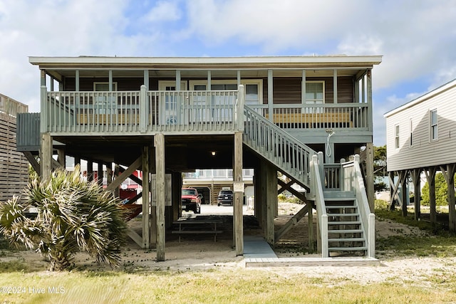 rear view of property with a porch