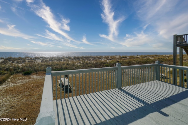 wooden deck with a water view