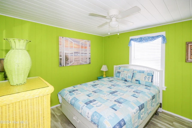 bedroom with light hardwood / wood-style flooring and ceiling fan