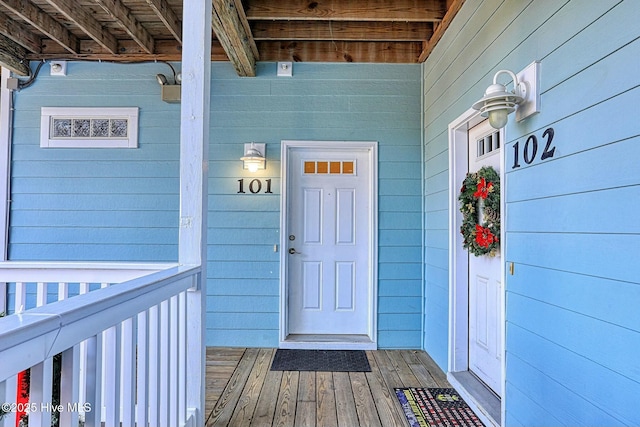 doorway to property featuring covered porch