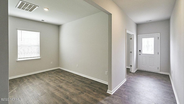 entryway with dark wood-type flooring