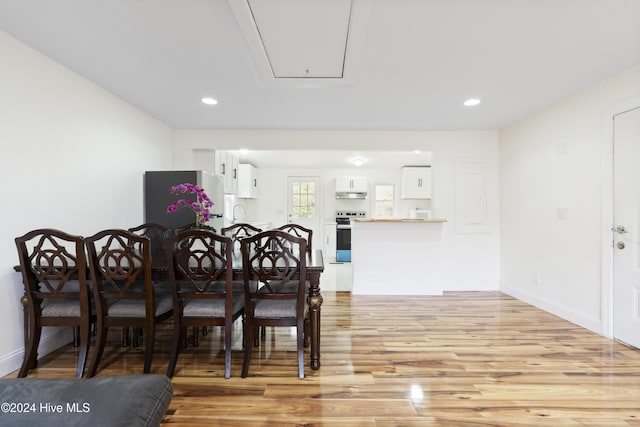 dining area with light hardwood / wood-style floors