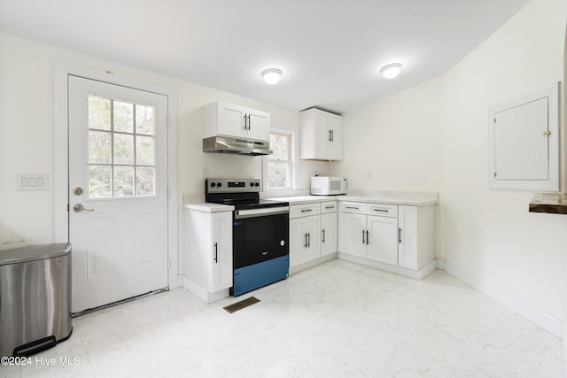 kitchen with white cabinets, stainless steel range with electric cooktop, and ventilation hood