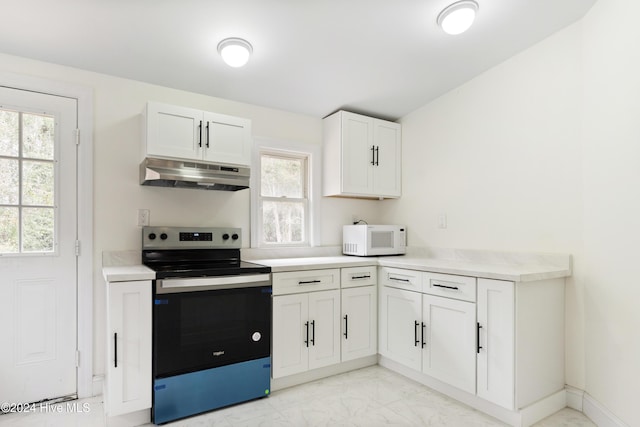 kitchen with electric stove, white cabinetry, and range hood